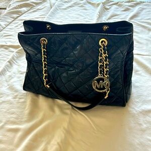 Michael Kors quilted black bag with gold accents